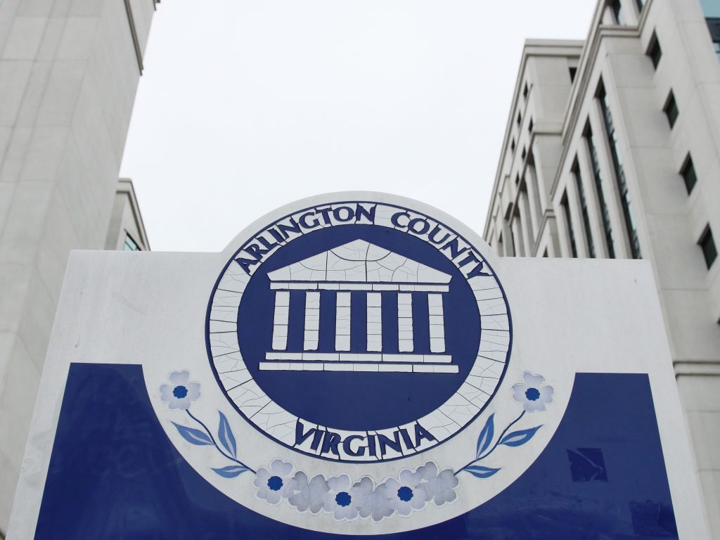 The Arlington County Seal is shown in front of the Arlington County Courthouse. The seal was adopted in 1983 based on a design submission from the Deputy General Counsel, Department of the Navy. (Alex Lucas / The Wash).