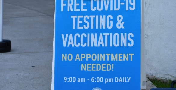 Signage for Free COVID-19 Testing & Vaccinations - No appointment needed! outside Dennis Avenue Health Center