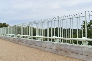 Tall fences line the sides of the Duke Ellington Bridge as suicide barriers.
