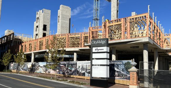 A sign for City Ridge in front of ongoing construction