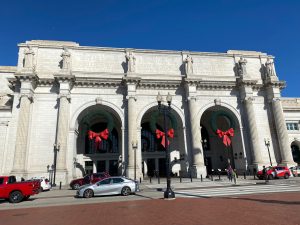 The marble front of Union Station, decorated with large wreaths.