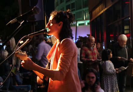 Musician Sara Curtin performing at Middle C Music during Art All Night 2022.