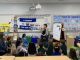 Emily Gasoi reads to students at Marie Reed Bilingual Elementary School (Courtesy Emily Gasoi)