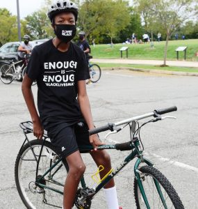Zachariah Dawson is a 12-year-old Arlington student who joined a bike rally protest this past weekend. Dawson said he is doing his part in demanding at APS (Photo taken by Alex Lucas).