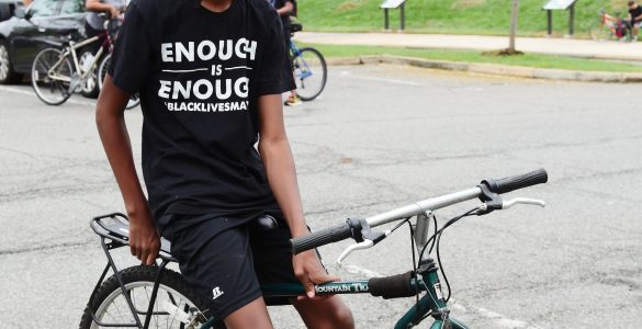 Zachariah Dawson is a 12-year-old Arlington student who joined a bike rally protest this past weekend. Dawson said he is doing his part in demanding at APS (Photo taken by Alex Lucas).