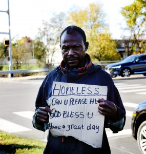 Moe Jackson stands at the intersection of Arlington Mills Road and Shirlington Road in the Arlington Nauck Community. According to Metropolitan Washington Council of Government’s 2020 survey, Black residents represent 10% of the total Arlington population but 38% of the county’s homeless population. (Alex Lucas / The Wash)