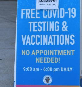 Signage for Free COVID-19 Testing & Vaccinations - No appointment needed! outside Dennis Avenue Health Center