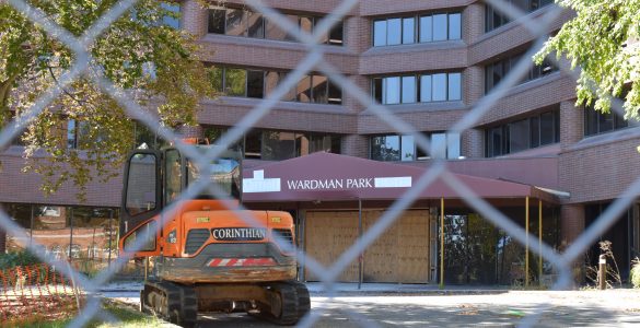 A construction vehicle sits outside the boarded up entrance of the Wardman Park Hotel