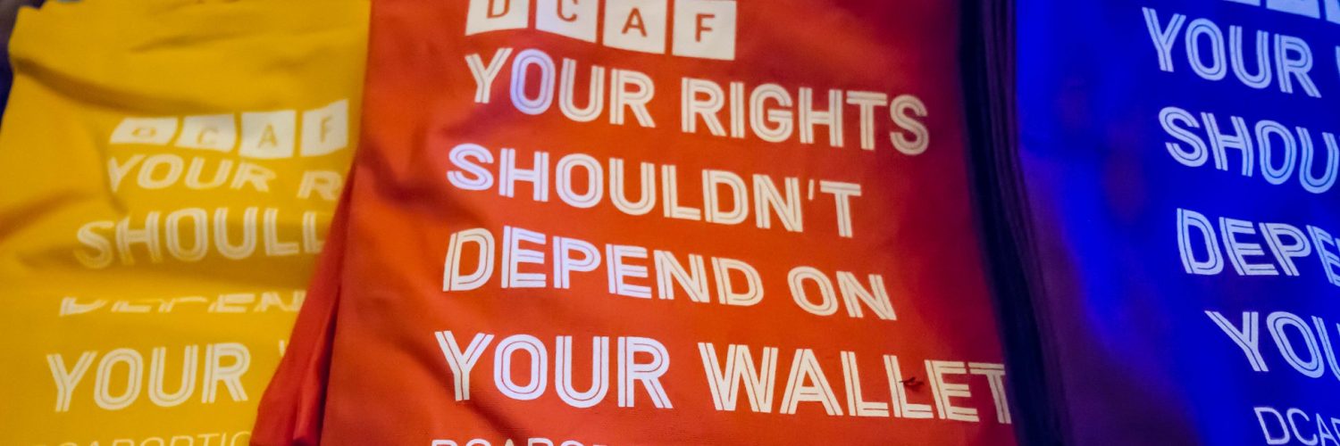 D.C. Abortion Fund branded bags read "Your right shouldn't depend on your wallet."