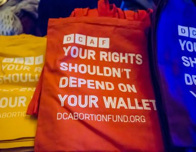 D.C. Abortion Fund branded bags read "Your right shouldn't depend on your wallet."