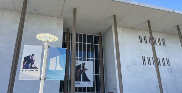 Outside the Kennedy Center with a large banner featuring a dance show.