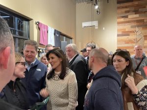 New Hampshire Governor walks with presidential candidate Haley. 