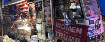 Trump merchandise van parked outside a Trump rally.