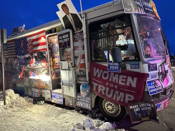 Trump merchandise van parked outside a Trump rally.