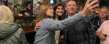 Republican primary presidential candidate Nikki Haley takes a selfie with potential voters.