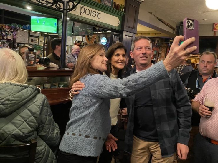 Republican primary presidential candidate Nikki Haley takes a selfie with potential voters.