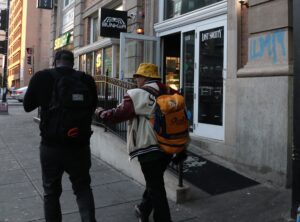 Two men walk outside of Bunker located at 14th and U Streets.