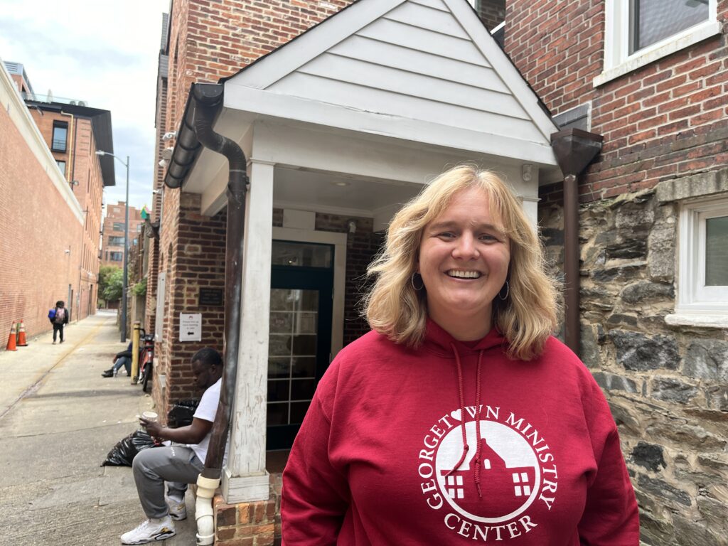 Executive Director of Georgetown Ministry Center smiling outside 