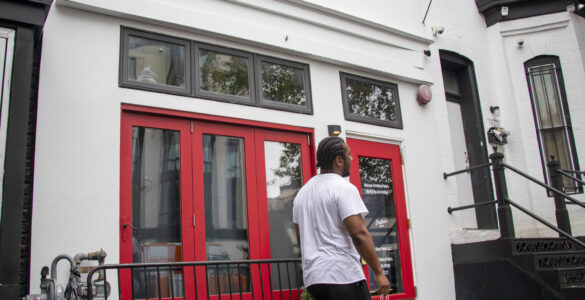 A man walks outside of Political Pattie's.