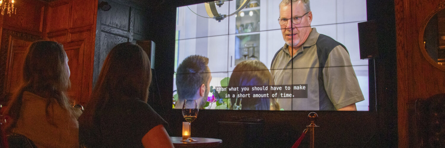 Two women watch Love is Blind at The Crown & Crow.