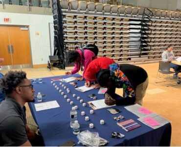DC election volunteers at a table with potential voters