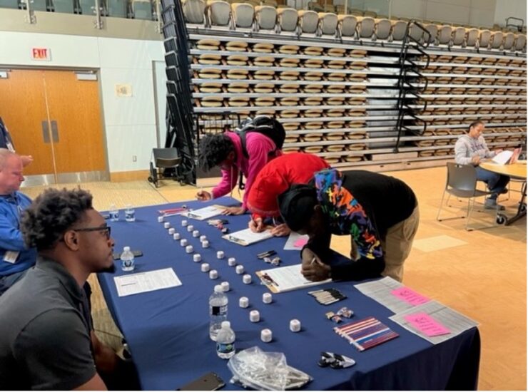 DC election volunteers at a table with potential voters