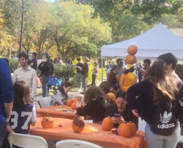 Festivalgoers gathered around tables set up in the park, painting pumpkins and engaging in conversations. Dupont Circle’s Fall Festival, Saturday, Oct. 26. Photo by Hajar Aboueddahab