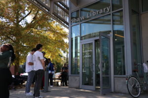 Voters stand outside of the Shaw Library.