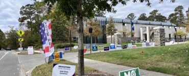 Candidate signs for Mo Green and Natasha Murdoch outside of an early voting site at Duke University.
