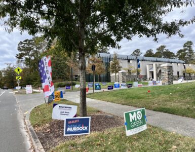 Candidate signs for Mo Green and Natasha Murdoch outside of an early voting site at Duke University.