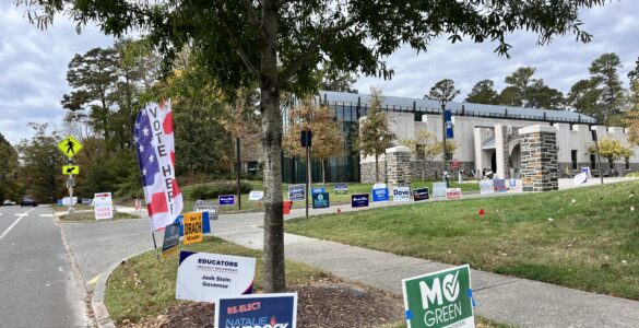 Candidate signs for Mo Green and Natasha Murdoch outside of an early voting site at Duke University.