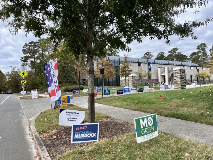 Candidate signs for Mo Green and Natasha Murdoch outside of an early voting site at Duke University.