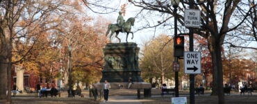 The Logan Circle statue with people surrounding.