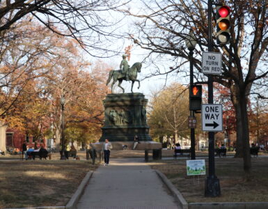 The Logan Circle statue with people surrounding.