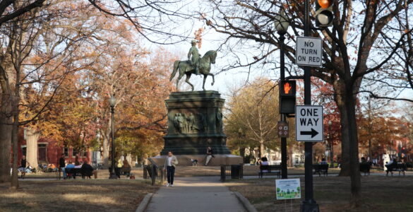 The Logan Circle statue with people surrounding.