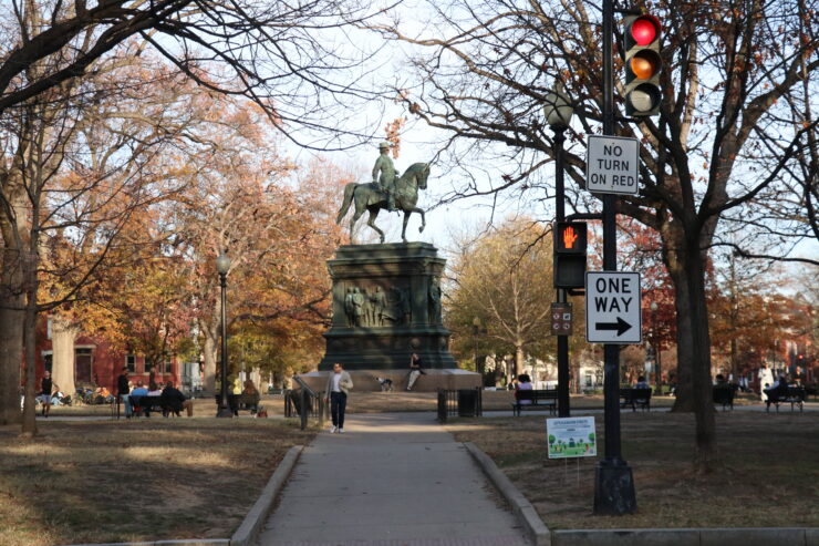 The Logan Circle statue with people surrounding.