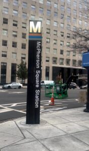 A sign outside the Metro stop says, "McPherson Square Station."