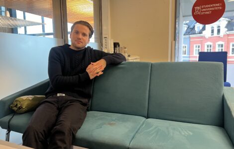 Mikkel Røed Nesse poses on a couch