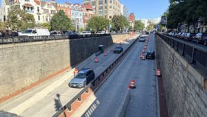 Traffic continues to flow through the Connecticut Avenue underpass, with orange barrels marking the upcoming deckover construction zone. (Yi Ya (Becky) Tseng)