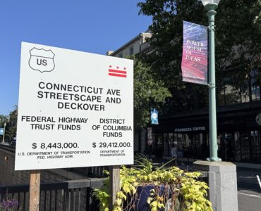 A project sign details the $37 million budget for the Connecticut Avenue Streetscape and Deckover, funded by both the federal government and the District.( Yi Ya (Becky) Tseng)