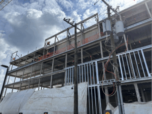 Construction workers build a self-storage facility off River Road in Bethesda, Maryland. Opponents of the development say the land below the construction is a historic African cemetery. (Kendall Staton)