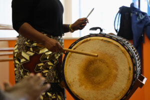 Jordyn Pigott playing the dunun at Ni Dembaya African Drum & Dance Ensemble. (Kelly Doyle)