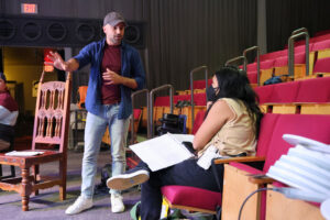 Director Mauricio Pita gives notes to actress Ixchel Hernández, who plays Héctor, during a rehearsal for Héctor, El Niño Eléctrico. (Kelly Doyle)