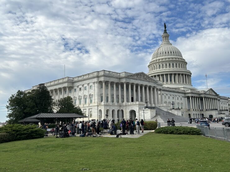 People stand outside the Capital Building on Wednesday, Oct. 15, 2025. (Isabel Del Mastro)