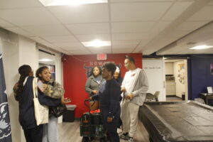 Students meeting in the Veteran Resource Center, located inside the Office of Military and Student Affairs at Howard University, before a fundraiser