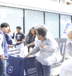 Members of the SVA host a fundraiser in front of the Blackburn Center while trying to convince Dr. Paris Adon, left, to join.
