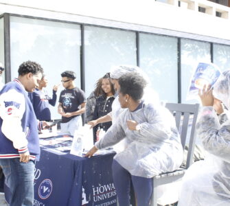 Members of the SVA host a fundraiser in front of the Blackburn Center while trying to convince Dr. Paris Adon, left, to join.
