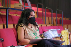 Ixchel Hernández, who portrays Héctor, listens as director Mauricio Pita gives notes during a rehearsal for Héctor, El Niño Eléctrico at GALA Hispanic Theatre. (Kelly Doyle)