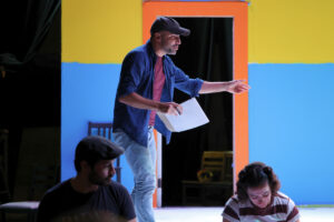 Director Mauricio Pita steps onto the stage to demonstrate a scene for his actors during a rehearsal for Héctor, El Niño Eléctrico. (Kelly Doyle)