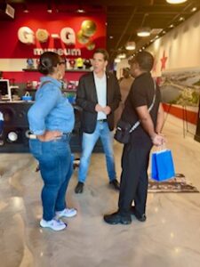 Scott Kratz (center) talks with Lovail and Angelique Long at the Go-Go Museum for the 11th Street Bridge Park song release. (Ellen Tannor)